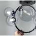 Люстра у формі кільця в чорному корпусі з плафонами Bubble